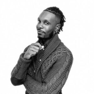 Dancer in cable knit sweater promoting AbunDance dance classes and performances.