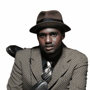 Stylish Black man with fedora and blazer posing in studio for fashion shoot.