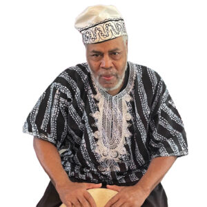 Traditional African dancer in colorful attire performing at AbunDance event.